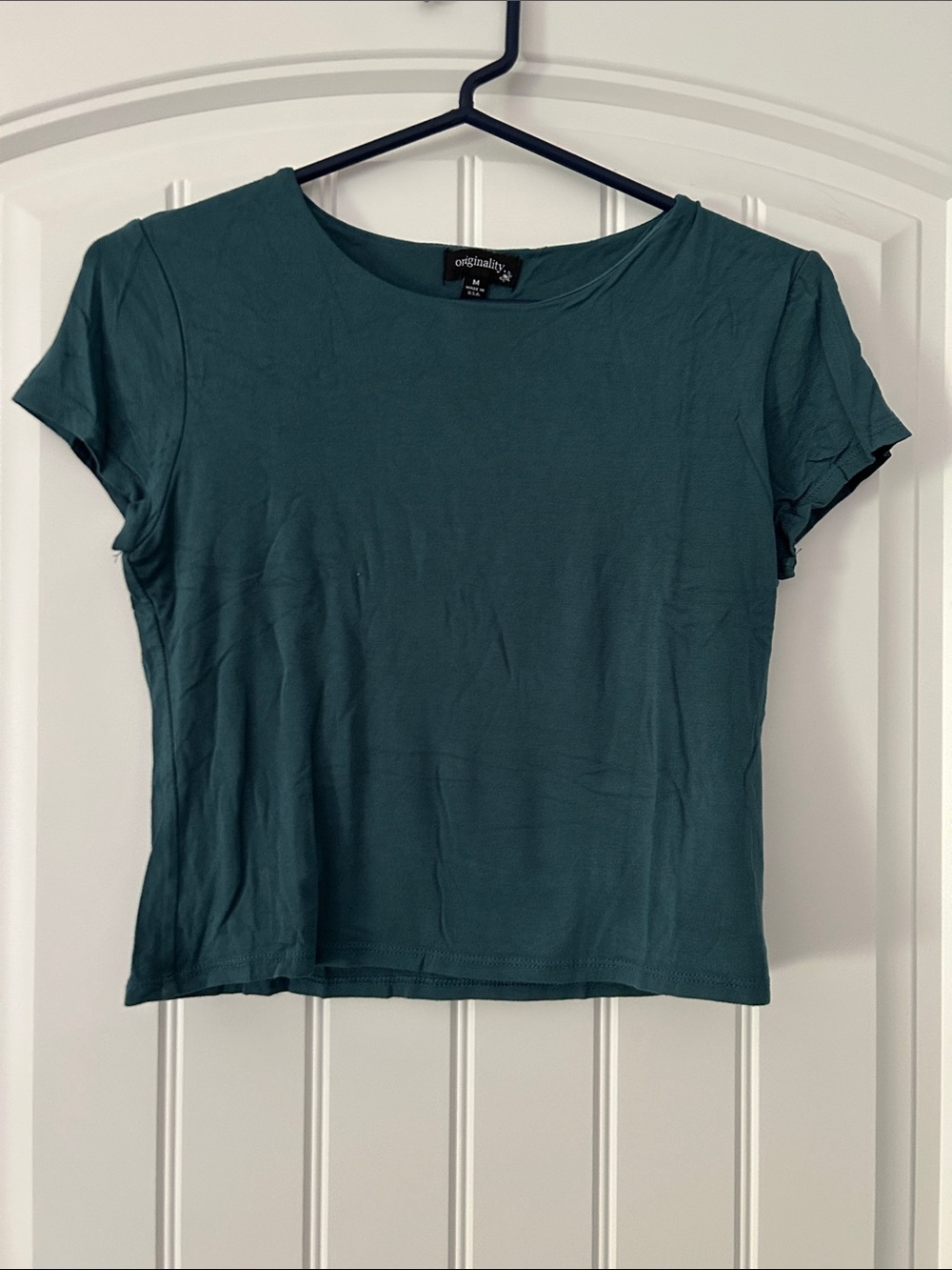Originality Lined Short Sleeve Teal T-shirt
Women’s Medium